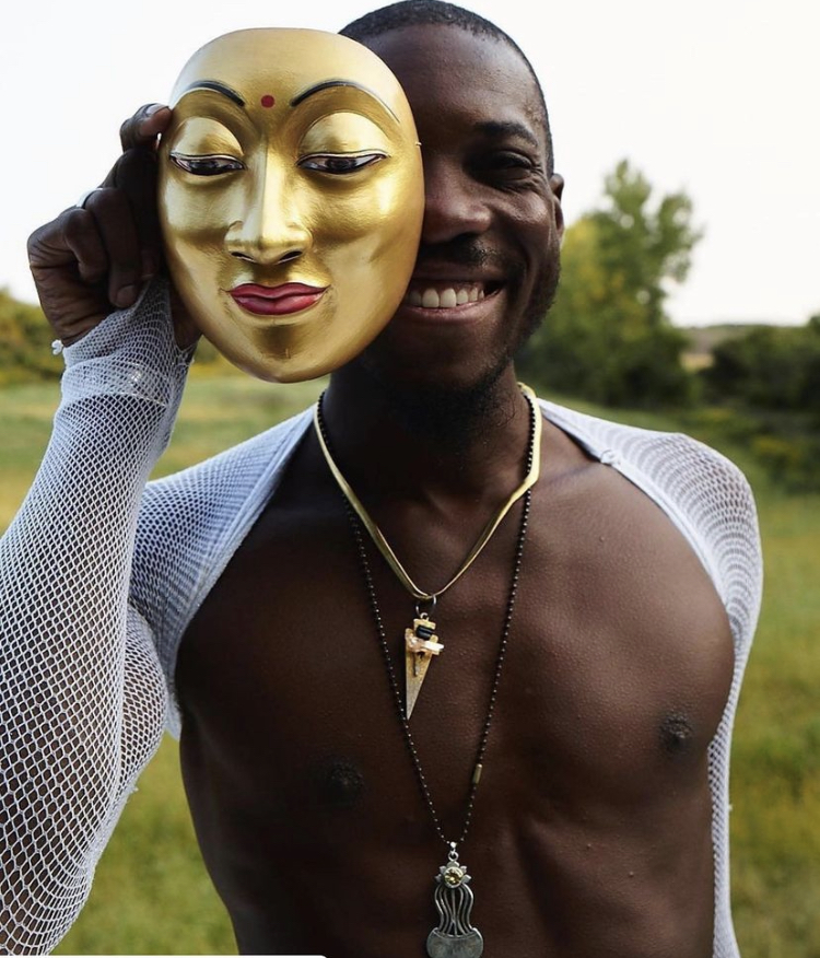 Akil Apollo Davis with one of his Balinese Masks.